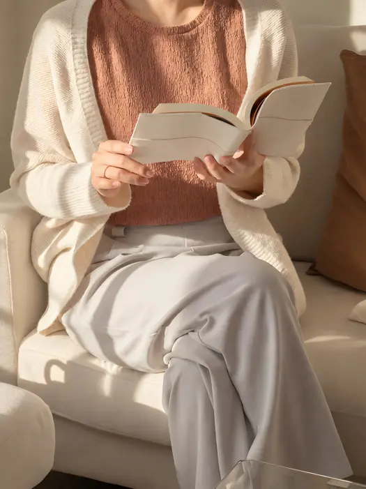 r-house-lifestyle-08-guest-reading-book-sofa.jpg